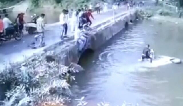 Se hizo viral en YouTube el instante en que un hombre lanza a su hijo a un puente para salvarle la vida. (Video: Captura)