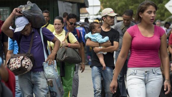 Los venezolanos contarán con un estatuto de protección temporal por diez años, tiempo en el cual podrán tramitar una visa de residentes si deciden quedarse en el país. (Foto: Raul ARBOLEDA / AFP)