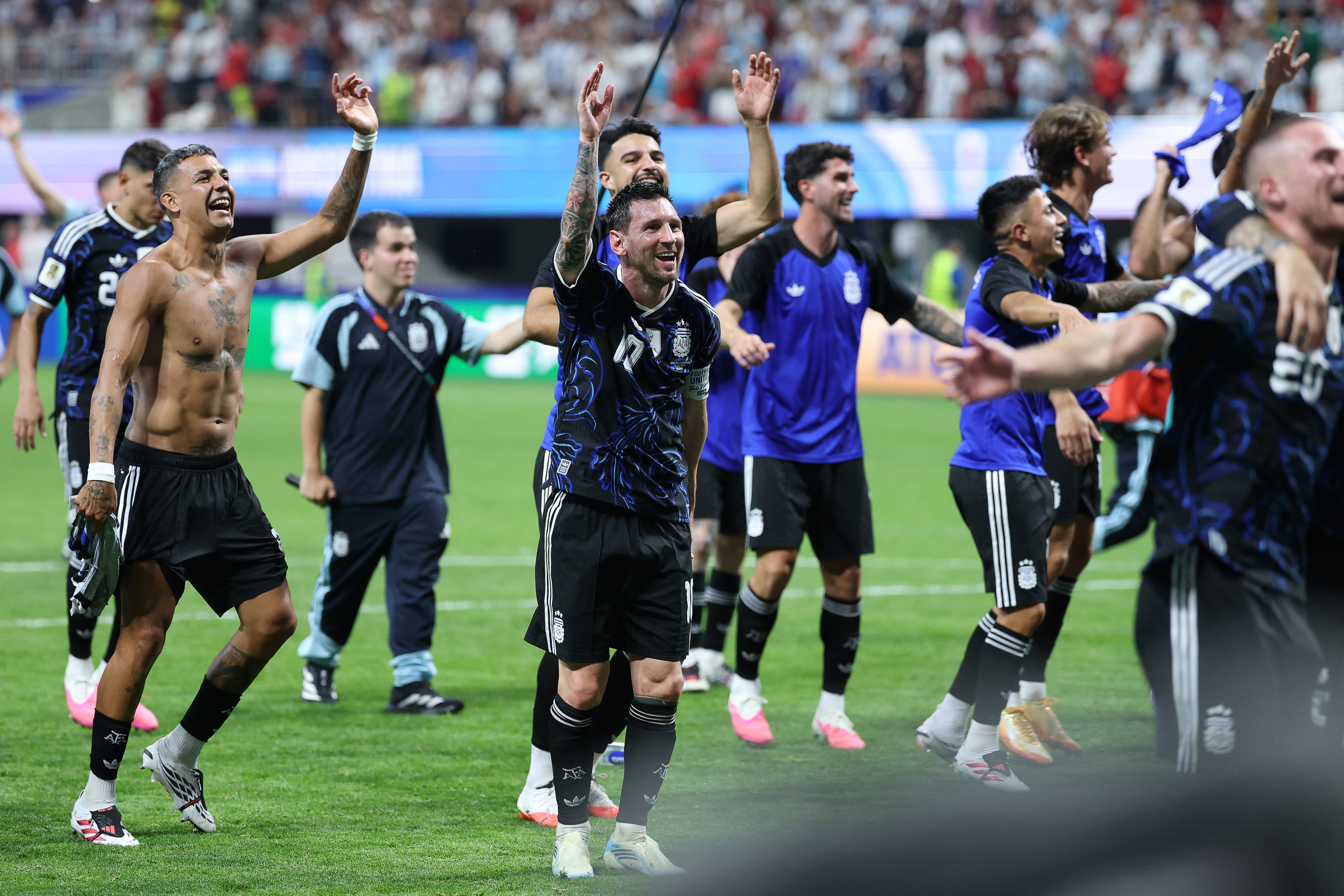 Argentina's forward #10 Lionel Messi celebrates with teammates after winning the 2026 World Cup football tournament semi-final match between England and Argentina at the Atlanta Stadium in Atlanta on July 15, 2026. (Photo by Thomas COEX / AFP)