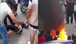 Los Olivos: Amarran y golpean a sujeto por robo a escolar y le queman la moto | VIDEO
