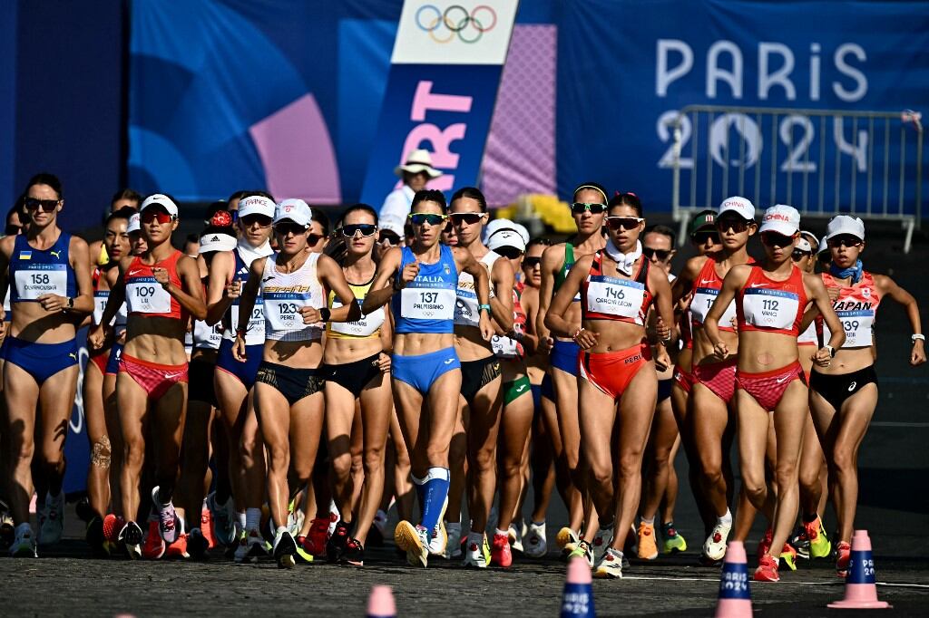 Italy's Antonella Palmisano (#137) leads the pack of the women's 20km race walk of the athletics event at the Paris 2024 Olympic Games at Trocadero in Paris on August 1, 2024. (Photo by Lionel BONAVENTURE / AFP)