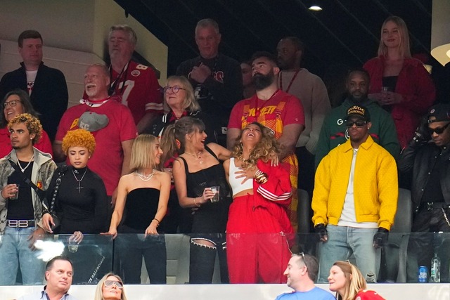 Taylor Swift, bottom left, and Blake Lively laugh before the NFL Super Bowl 58 football game between the San Francisco 49ers and the Kansas City Chiefs on Sunday, Feb. 11, 2024, in Las Vegas. (AP Photo/Julio Cortez)
