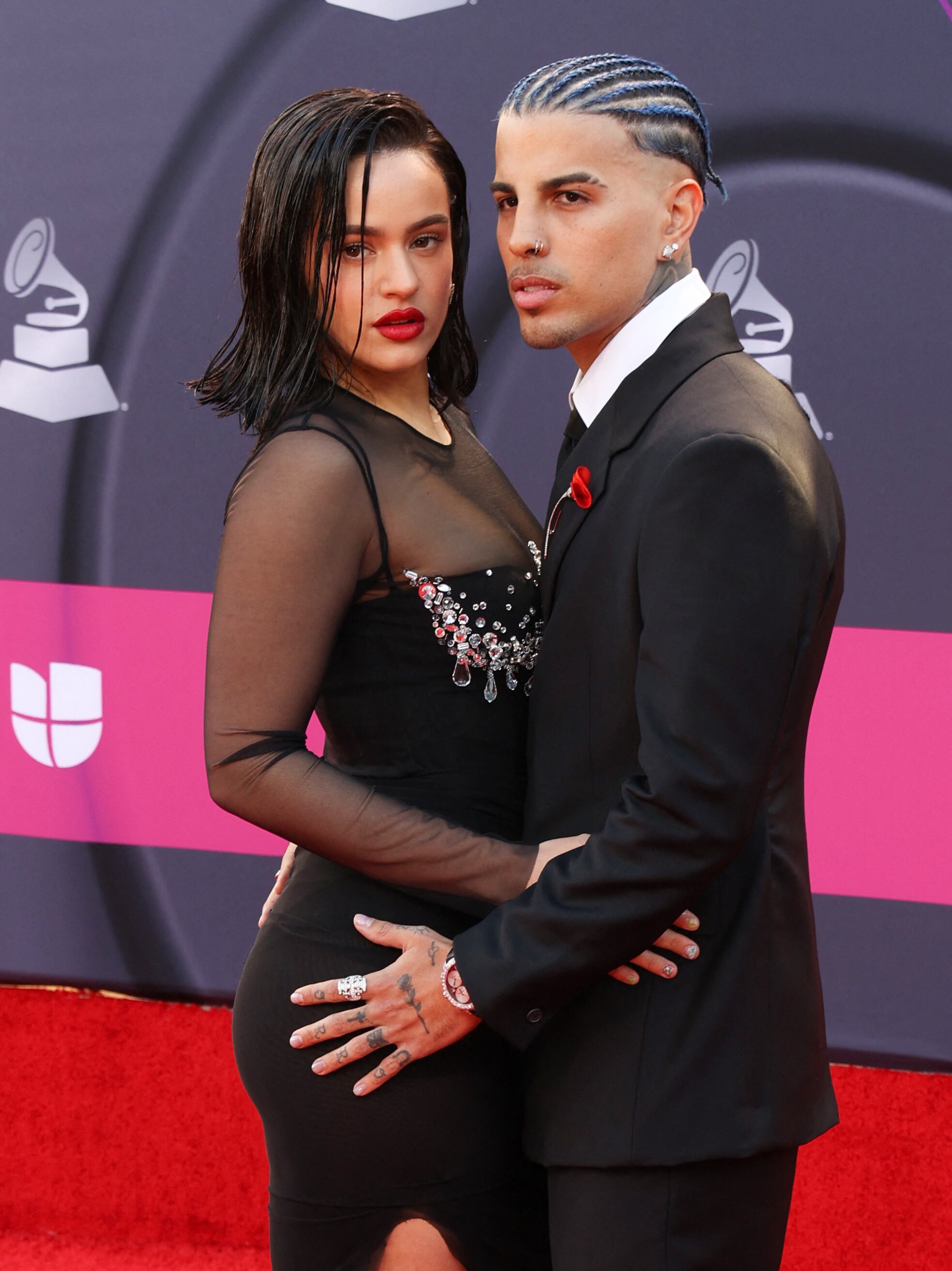 Puerto Rican singer Rauw Alejandro and Spanish singer Rosalia arrive for the 23rd Annual Latin Grammy awards at the Mandalay Bay's Michelob Ultra Arena in Las Vegas, Nevada, on November 17, 2022. (Photo by Ronda CHURCHILL / AFP)