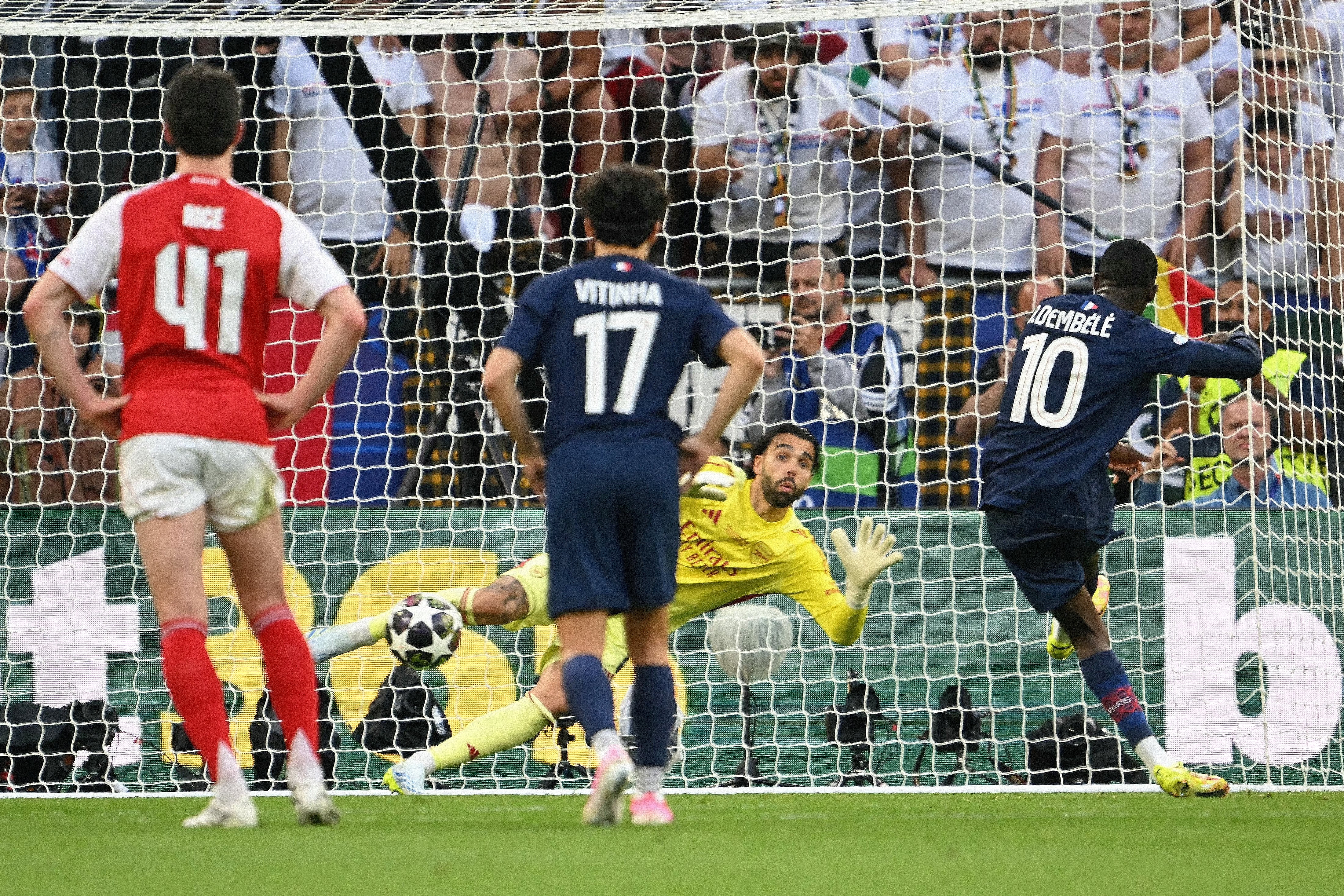 Paris Saint-Germain's French forward #10 Ousmane Dembele (R) scores his team's first goal after penalty during the UEFA Champions League final football match between Paris Saint-Germain (PSG) and Arsenal FC at the Puskas Arena in Budapest on May 30, 2026. (Photo by NICOLAS TUCAT / AFP)