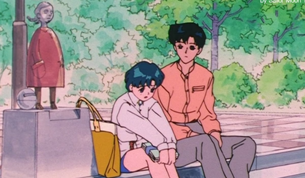 En un episodio de Sailor Moon S, Amy se sienta a platicar junto con Darien al lado de la escultura. (Foto: Toei)