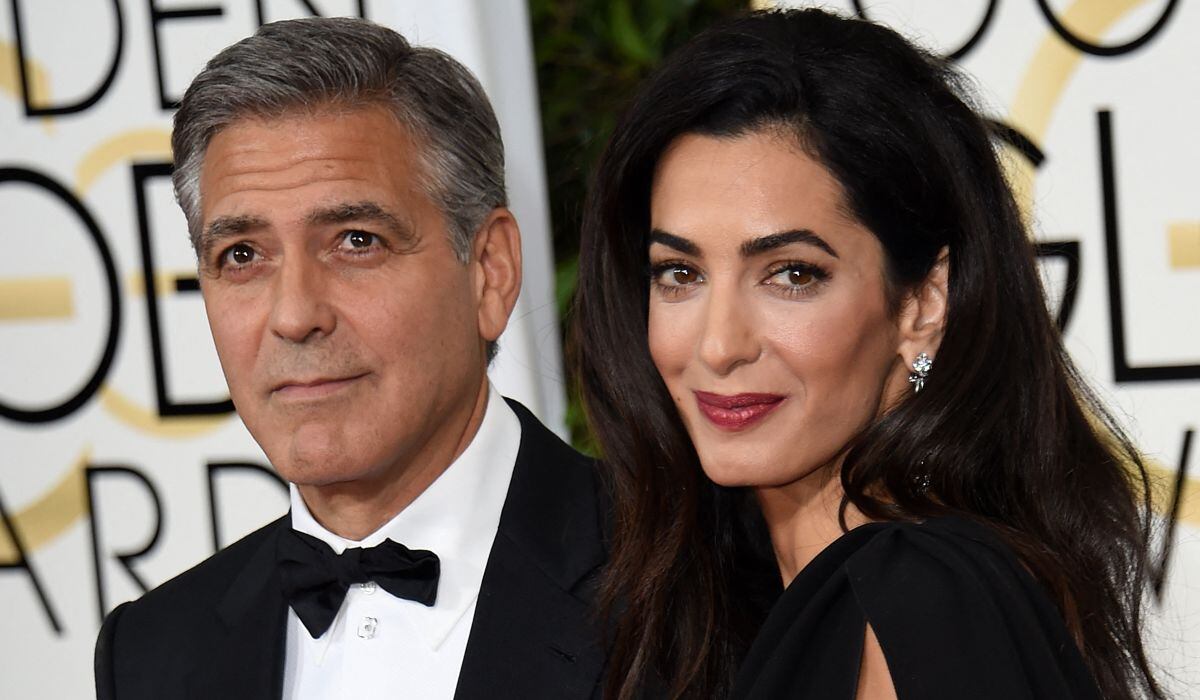 El actor George Clooney y su esposa Amal Clooney. Esta imagen es cuando llegan a la alfombra roja para la 72° entrega anual de los Globos de Oro, el 11 de enero de 2015 en el Beverly Hilton (Foto: Mark Ralston / AFP)