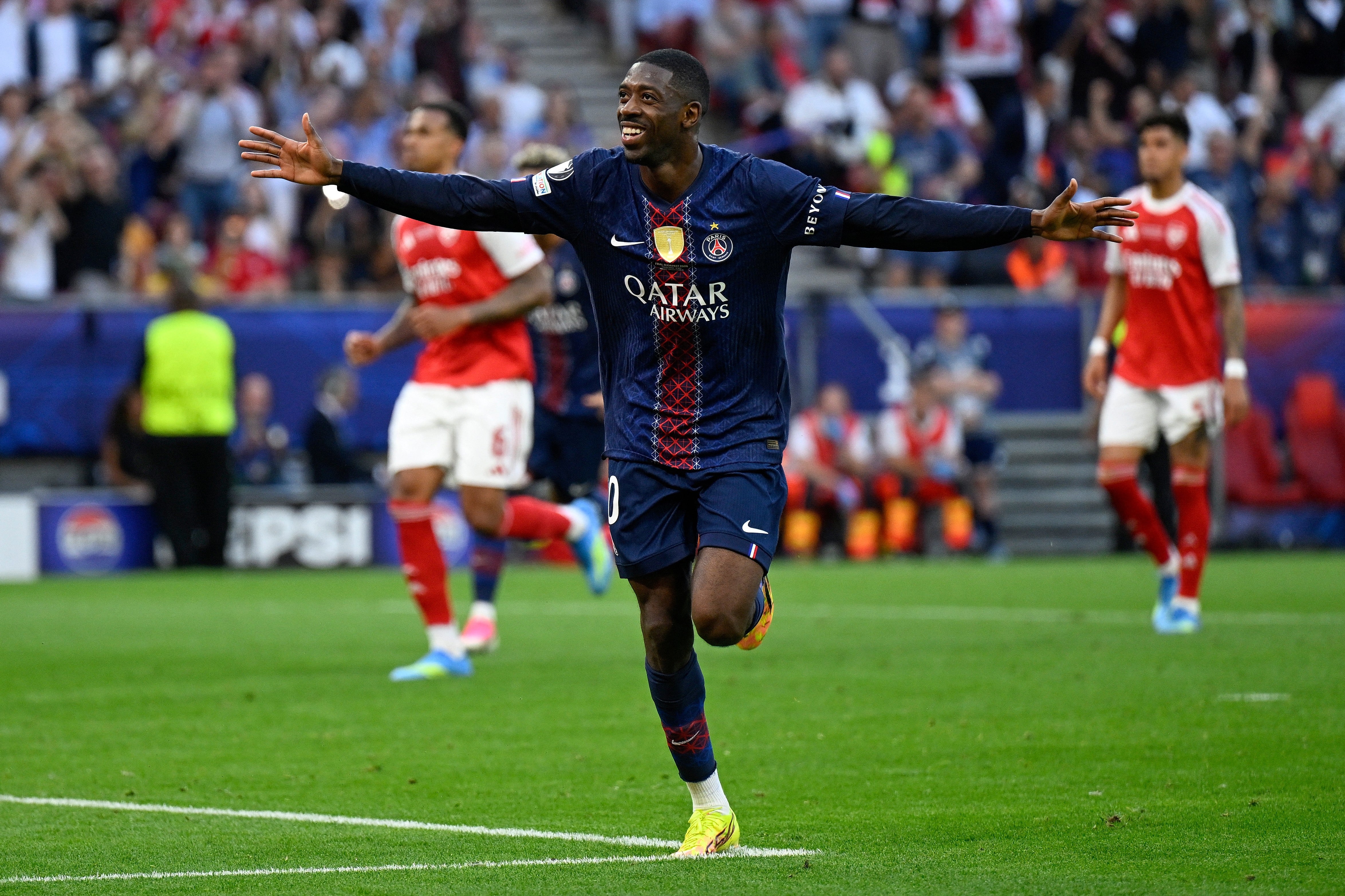 Paris Saint-Germain's French forward #10 Ousmane Dembele celebrates after scoring his team's first goal after penalty during the UEFA Champions League final football match between Paris Saint-Germain (PSG) and Arsenal FC at the Puskas Arena in Budapest on May 30, 2026. (Photo by INA FASSBENDER / AFP)