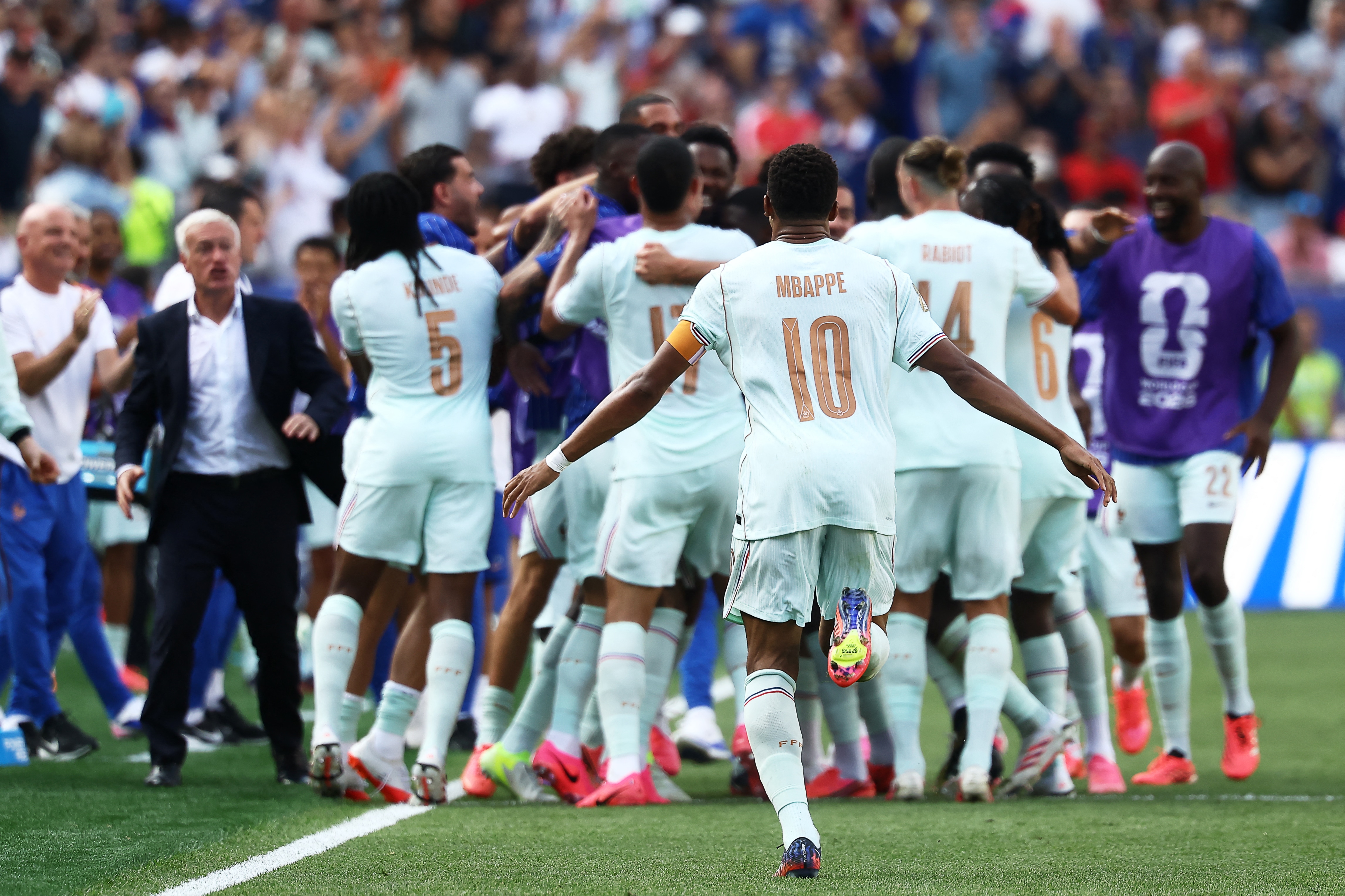 France's players celebrate forward #07 Ousmane Dembele (unseen) scoring his team�s second goal during the 2026 World Cup football tournament quarter-final match between France and Morocco at Boston Stadium in Foxborough on July 9, 2026. (Photo by CHARLY TRIBALLEAU / AFP)
