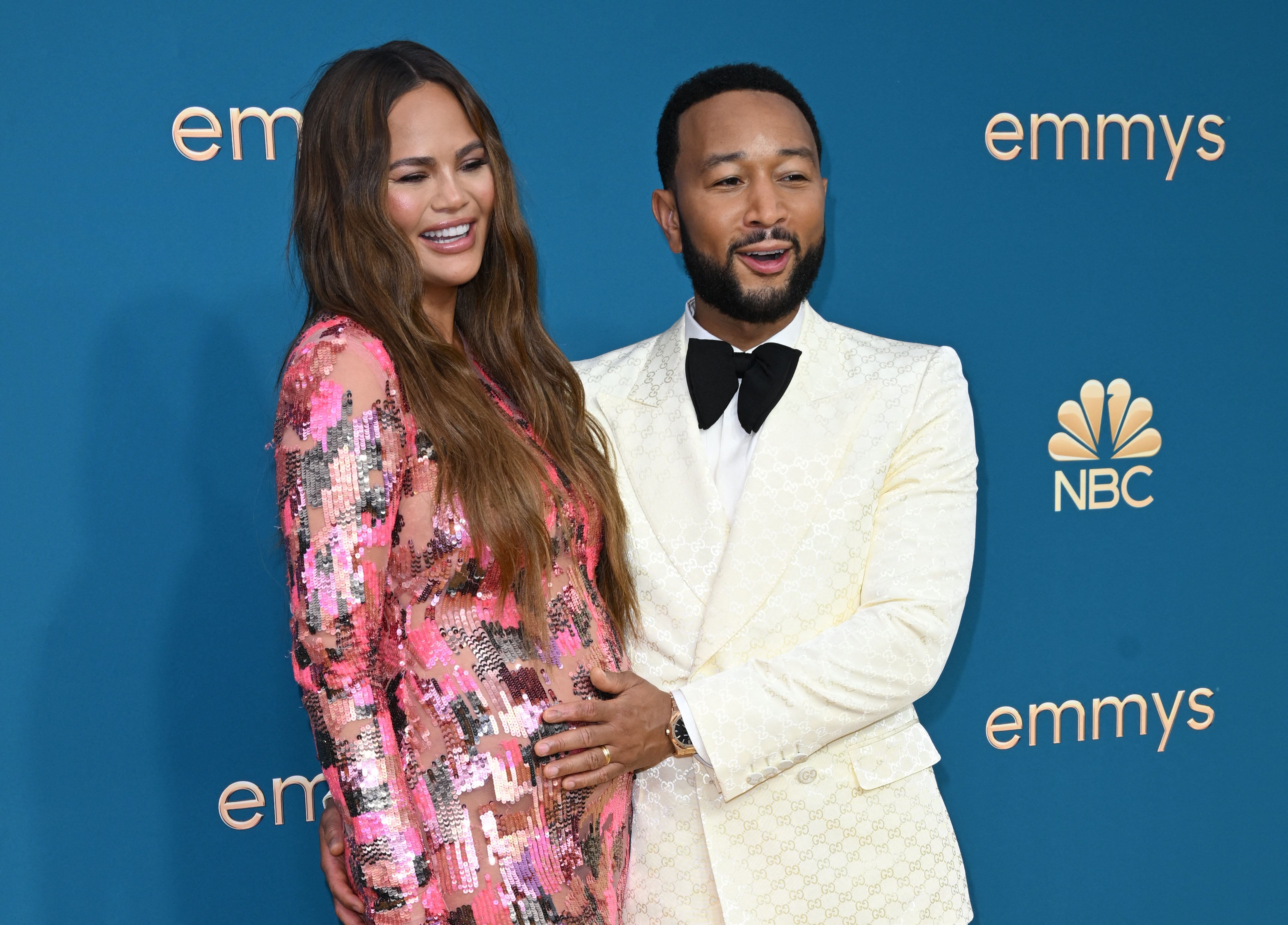 John Legend(R) and Chrissy Teigen arrive for the 74th Emmy Awards at the Microsoft Theater in Los Angeles, California, on September 12, 2022. (Photo by Robyn BECK / AFP)