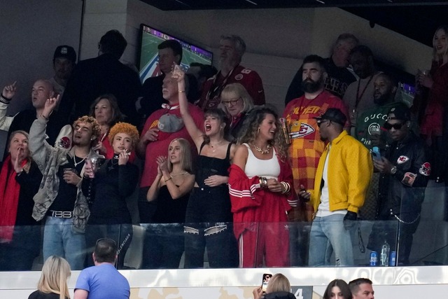 Taylor Swift, center, cheers before the NFL Super Bowl 58 football game between the Kansas City Chiefs and the San Francisco 49ers on Sunday, Feb. 11, 2024, in Las Vegas. Ice Spice is seen third bottom from left. (AP Photo/Brynn Anderson)