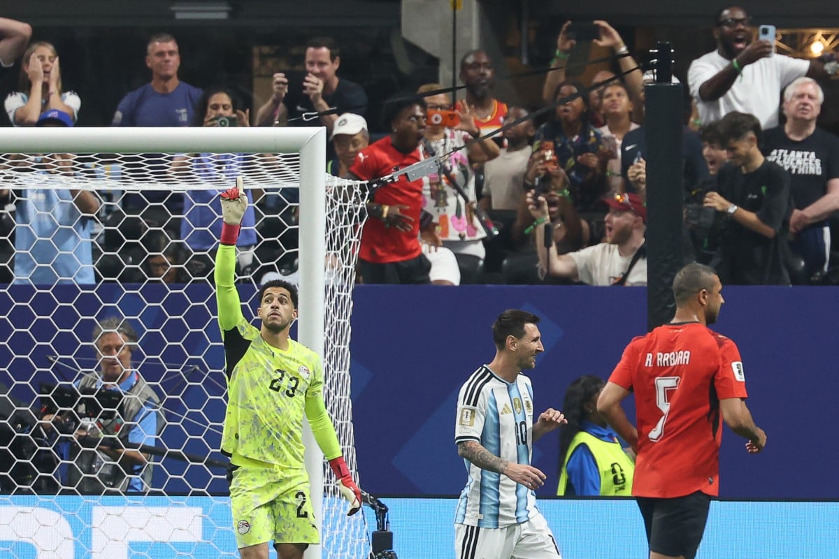 Egypt's goalkeeper #23 Mostafa Shoubir celebrates after stopping a penalty shoot by Argentina's forward #10 Lionel Messi during the 2026 World Cup round of 16 football match between Argentina and Egypt at Atlanta Stadium in Atlanta on July 7, 2026. (Photo by Odd ANDERSEN / AFP)