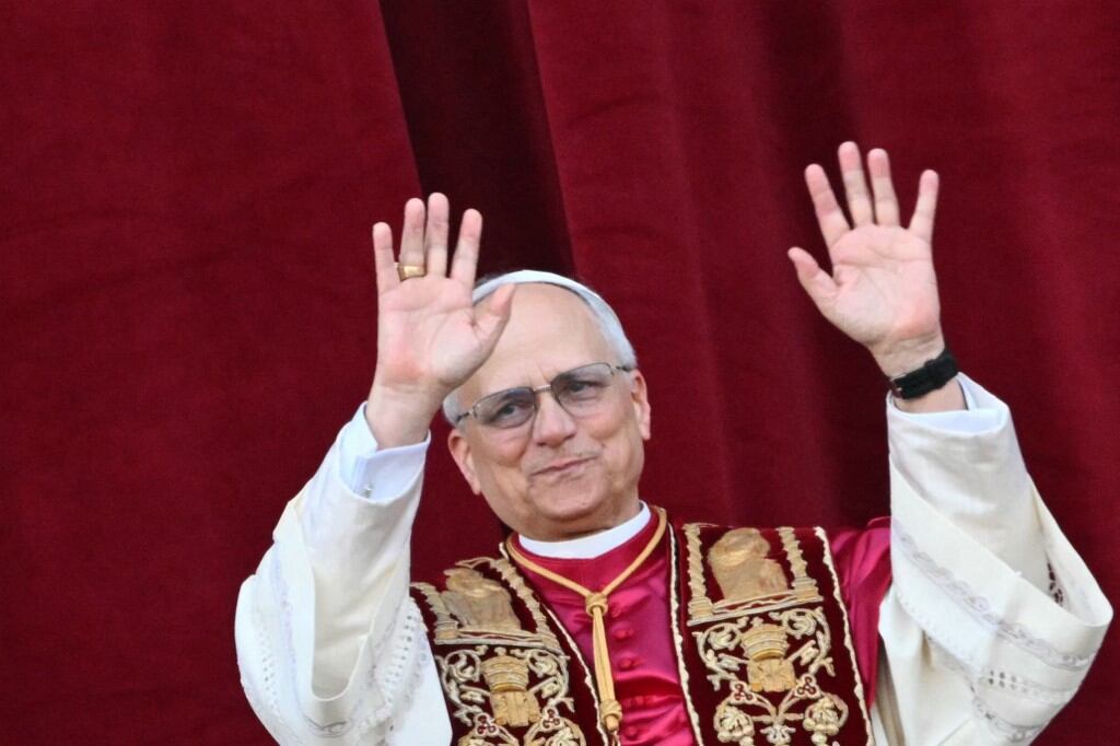 Newly elected Pope Leo XIV, Robert Prevost addresses the crowd on the main central loggia balcony of the St Peter's Basilica for the first time, after the cardinals ended the conclave, in The Vatican, on May 8, 2025. Robert Francis Prevost was on Thursday elected the first pope from the United States, the Vatican announced. A moderate who was close to Pope Francis and spent years as a missionary in Peru, he becomes the Catholic Church's 267th pontiff, taking the papal name Leo XIV. (Photo by Alberto PIZZOLI / AFP)