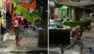 Hombre se vuelve viral en Río de Janeiro al usar una hoja gigante como paraguas
