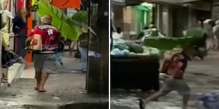 Hombre se vuelve viral en Río de Janeiro al usar una hoja gigante como paraguas