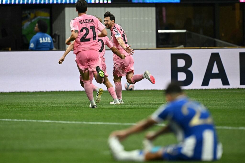 Inter Miami's Argentine forward #10 Lionel Messi (C) celebrates after scoring his team's second goal during the FIFA Club World Cup 2025 Group A football match between US Inter Miami and Portugal's FC Porto at the Mercedes-Benz stadium in Atlanta on June 19, 2025. (Photo by Paul ELLIS / AFP)