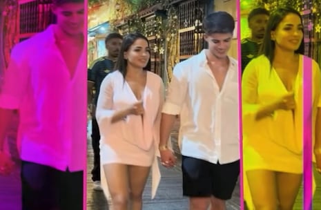 Onelia Molina y Kevin Díaz caminan de la mano durante viaje a Colombia