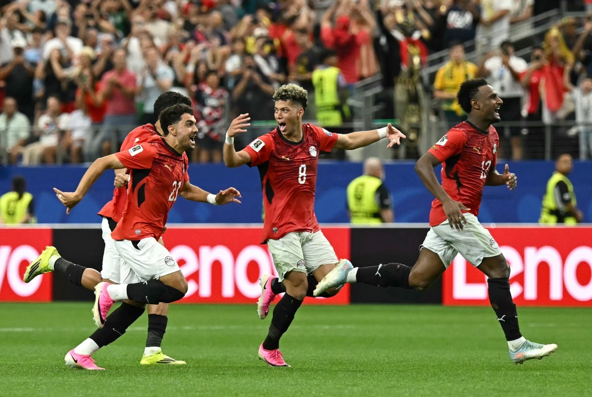 Egypt's players celebrate after winning the 2026 World Cup round of 32 football match between Australia and Egypt at the Dallas Stadium in Arlington on July 3, 2026. (Photo by Paul ELLIS / AFP)