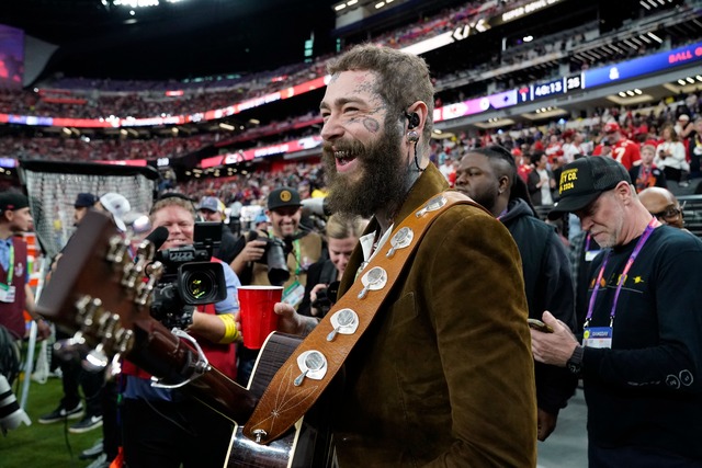US rapper Post Malone is seen during Super Bowl LVIII between the Kansas City Chiefs and the San Francisco 49ers at Allegiant Stadium in Las Vegas, Nevada, February 11, 2024. (Photo by TIMOTHY A. CLARY / AFP)
