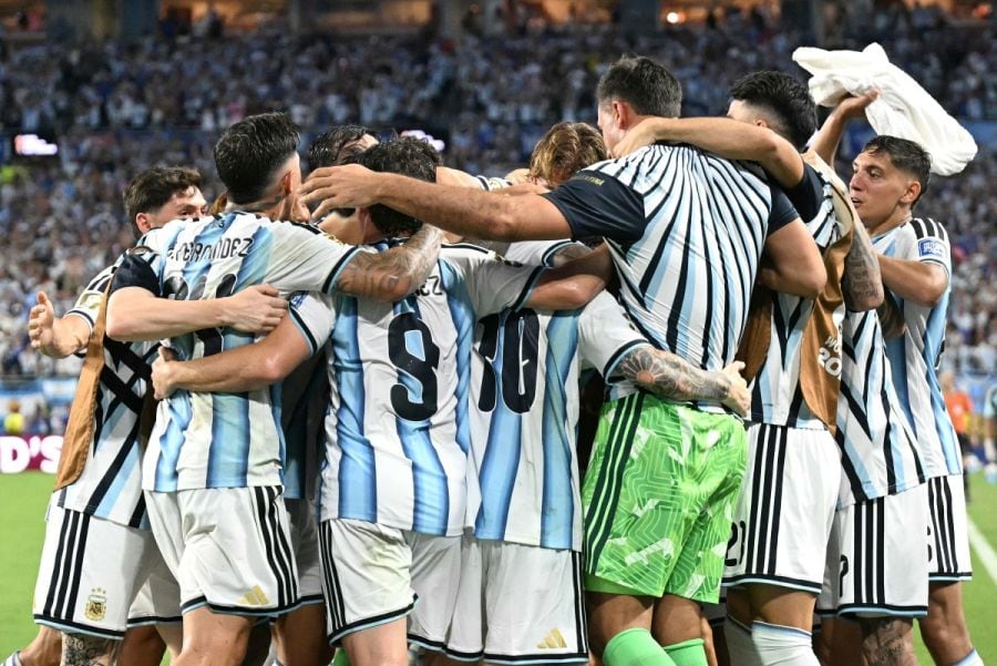Argentina's defender #13 Cristian Romero (unseen) celebrates with teammates scoring his team's third goal during the 2026 World Cup round of 32 football match between Argentina and Cape Verde at the Miami Stadium in Miami Gardens on July 3, 2026. (Photo by CHANDAN KHANNA / AFP)