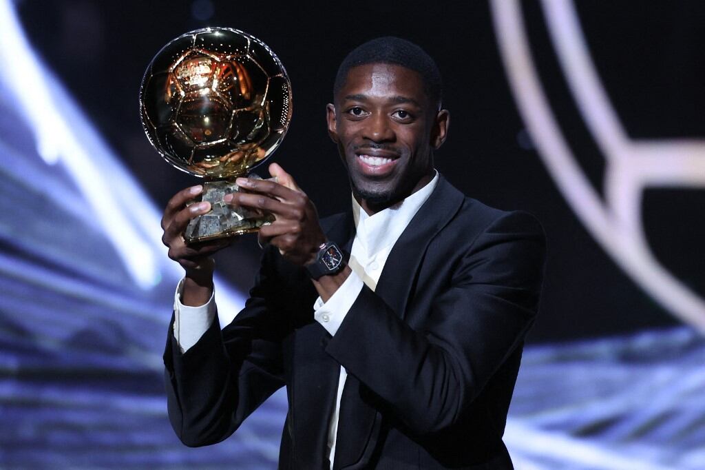 Paris Saint-Germain's French forward Ousmane Dembele speaks after receiving the Ballon d'Or award during the 2025 Ballon d'Or France Football award ceremony at the Theatre du Chatelet in Paris on September 22, 2025. (Photo by Franck FIFE / AFP)