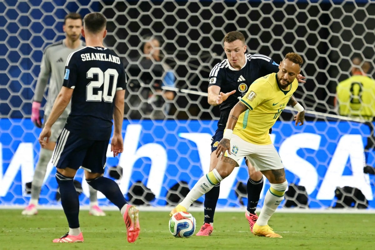 Brazil's forward #10 Neymar and Scotland's midfielder #19 Lewis Ferguson fight for the ball during the 2026 World Cup Group C football match between Scotland and Brazil at the Miami Stadium in Miami Gardens on June 24, 2026. (Photo by CHANDAN KHANNA / AFP)