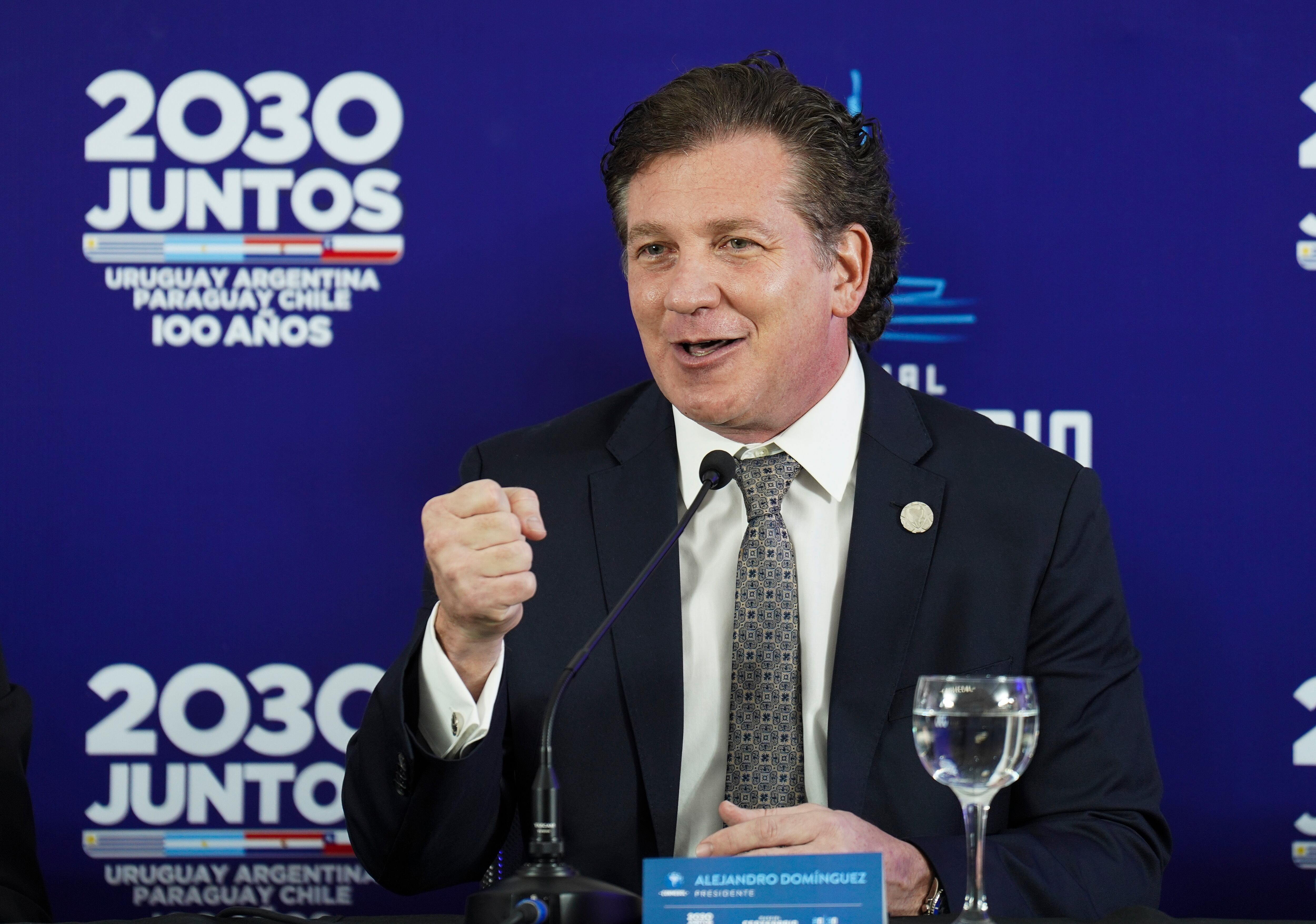 President of the CONMEBOL Alejandro Dominguez speaks during a press conference for a joint bid to host the 2030 FIFA World Cup with the hope of bringing the global showpiece back to its first home at Centenario Stadium in Montevideo, Uruguay, Tuesday, Aug. 2, 2022. (AP Photo/Matilde Campodonico)