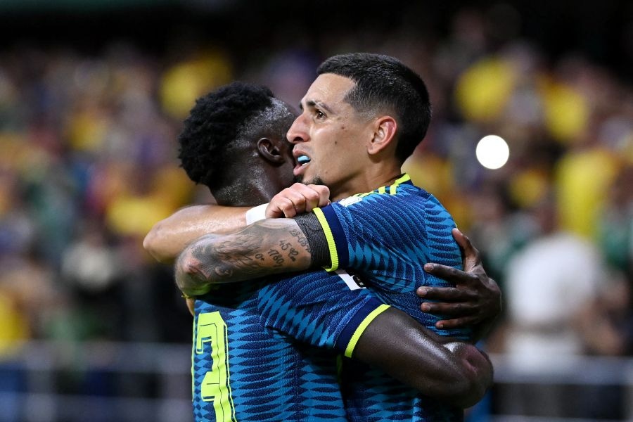 Colombia's defender #02 Daniel Munoz (R) celebrates scoring his team's first goal with teammate defender #23 Davinson Sanchez (L) during the 2026 World Cup Group K football match between Uzbekistan and Colombia at the Mexico City Stadium in Mexico City on June 17, 2026. (Photo by CARL DE SOUZA / AFP)